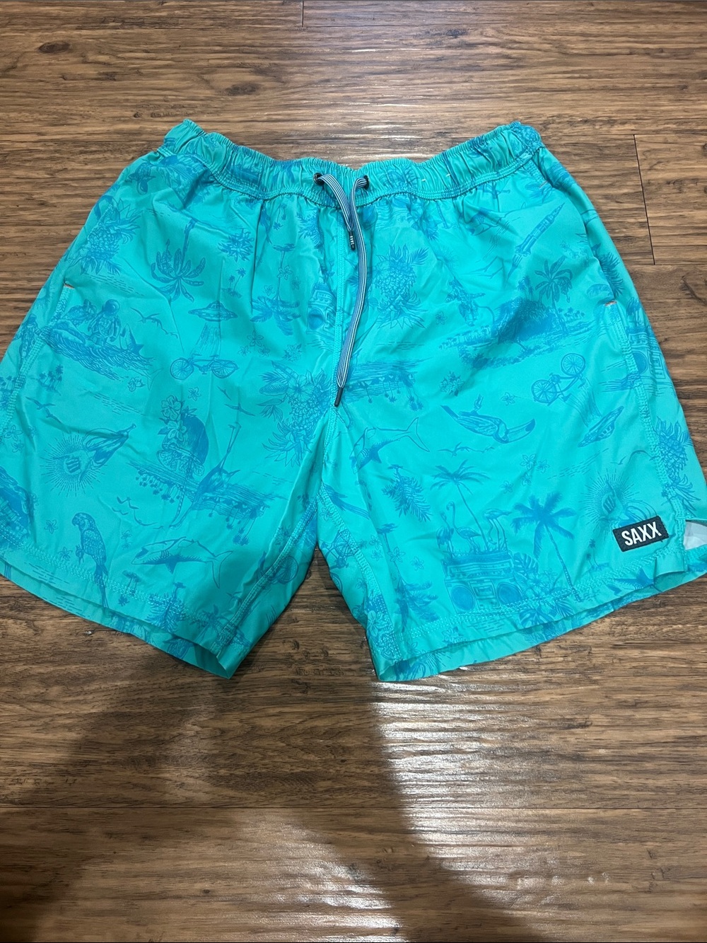 Saxx Teal Tropical Print Men's Swim Trunks
Size: L
7”